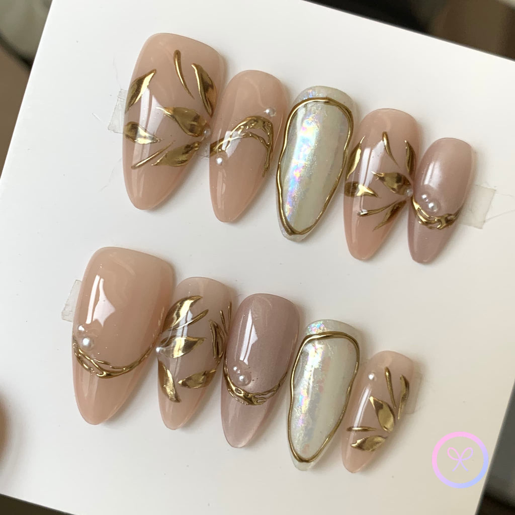 elegant nude glossy short almond press on nails with gingko leaves and cat eye