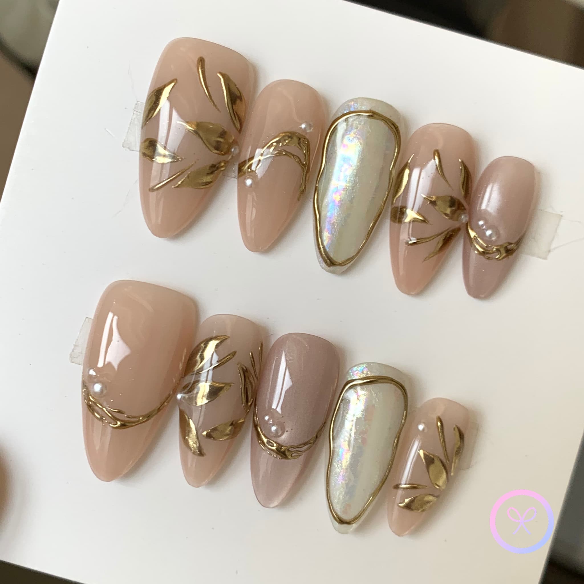 elegant nude glossy short almond press on nails with gingko leaves and cat eye