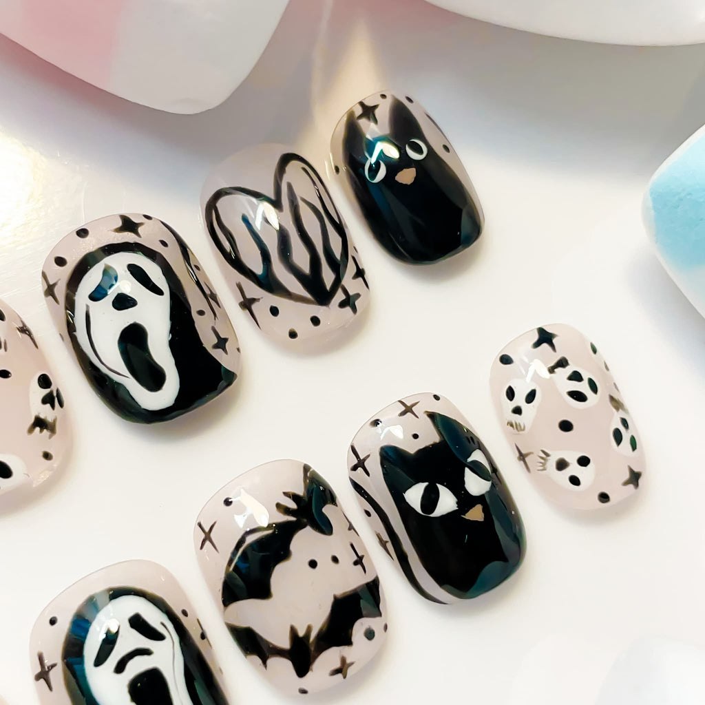 short length black squoval press on nails with halloween and cat design