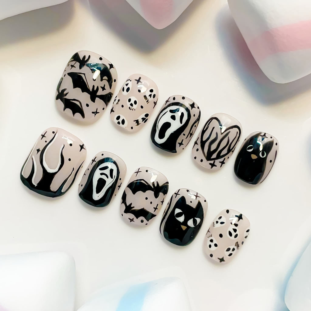 short length black squoval press on nails with halloween and cat design