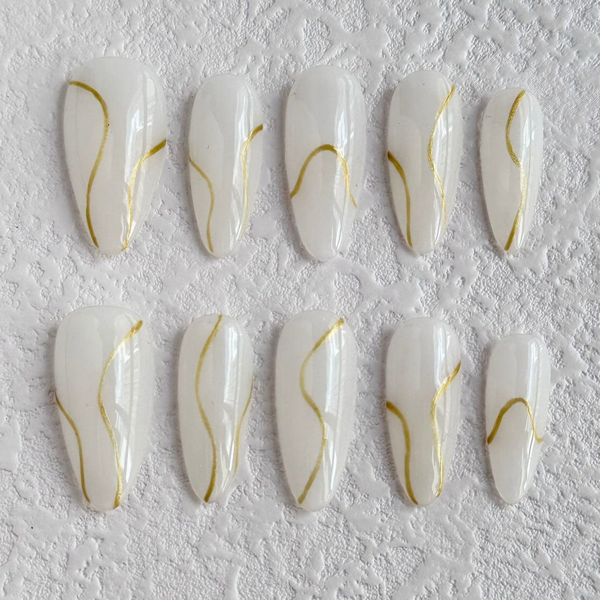 medium white smoke almond press on nails with golden lines