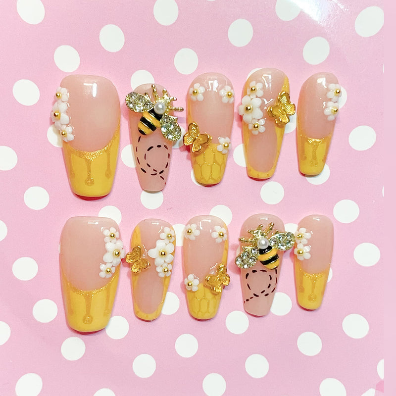 medium length gold coffin press on nails with bee design
