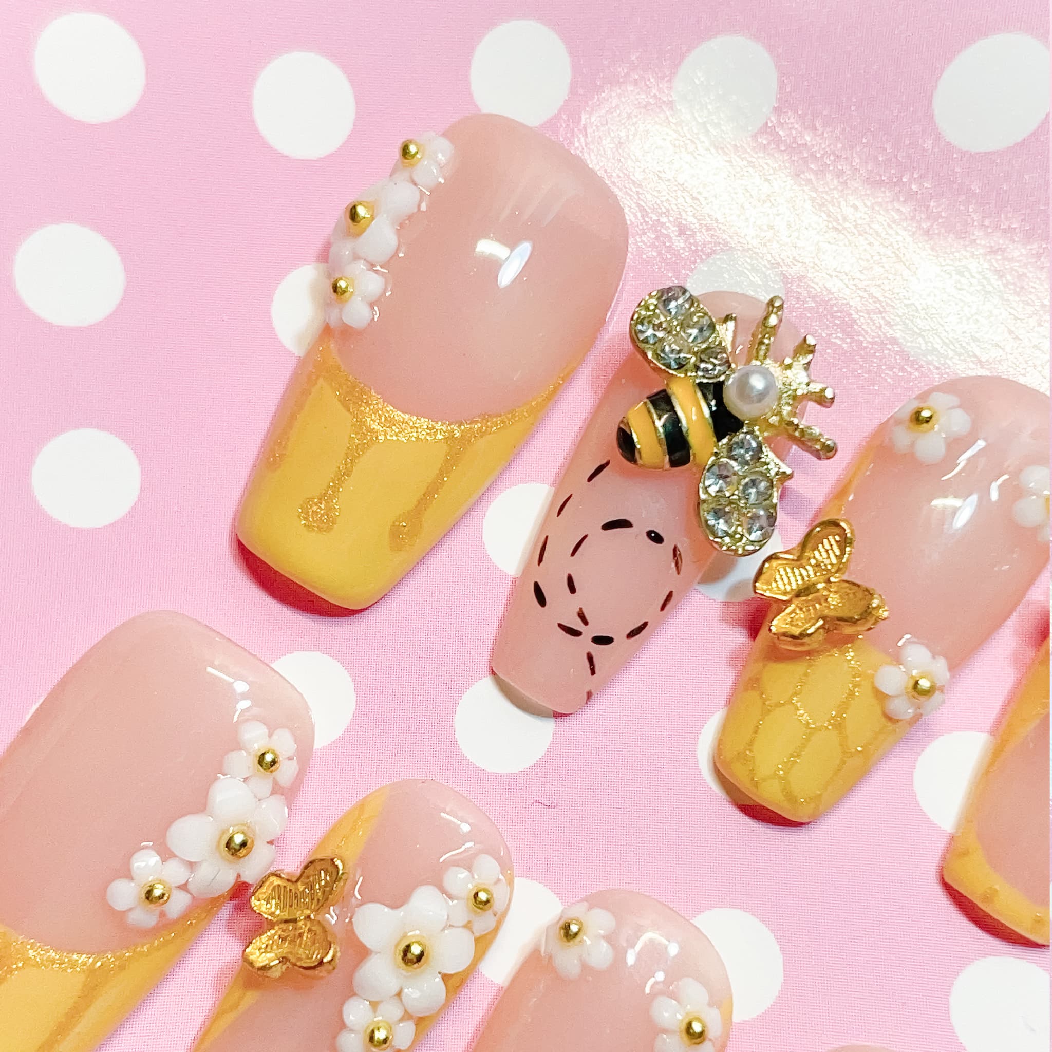 medium length gold coffin press on nails with bee design