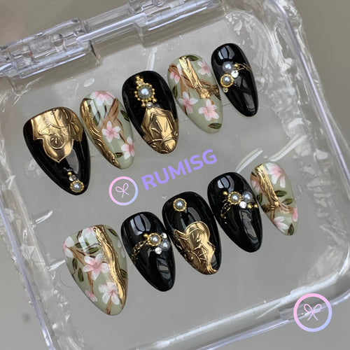 baroque black glossy short almond press on nails with gold crest and cherry blossom