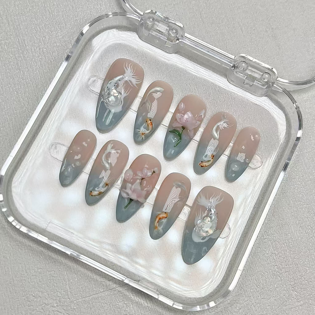 medium length light cyan almond press on nails with koi fish design