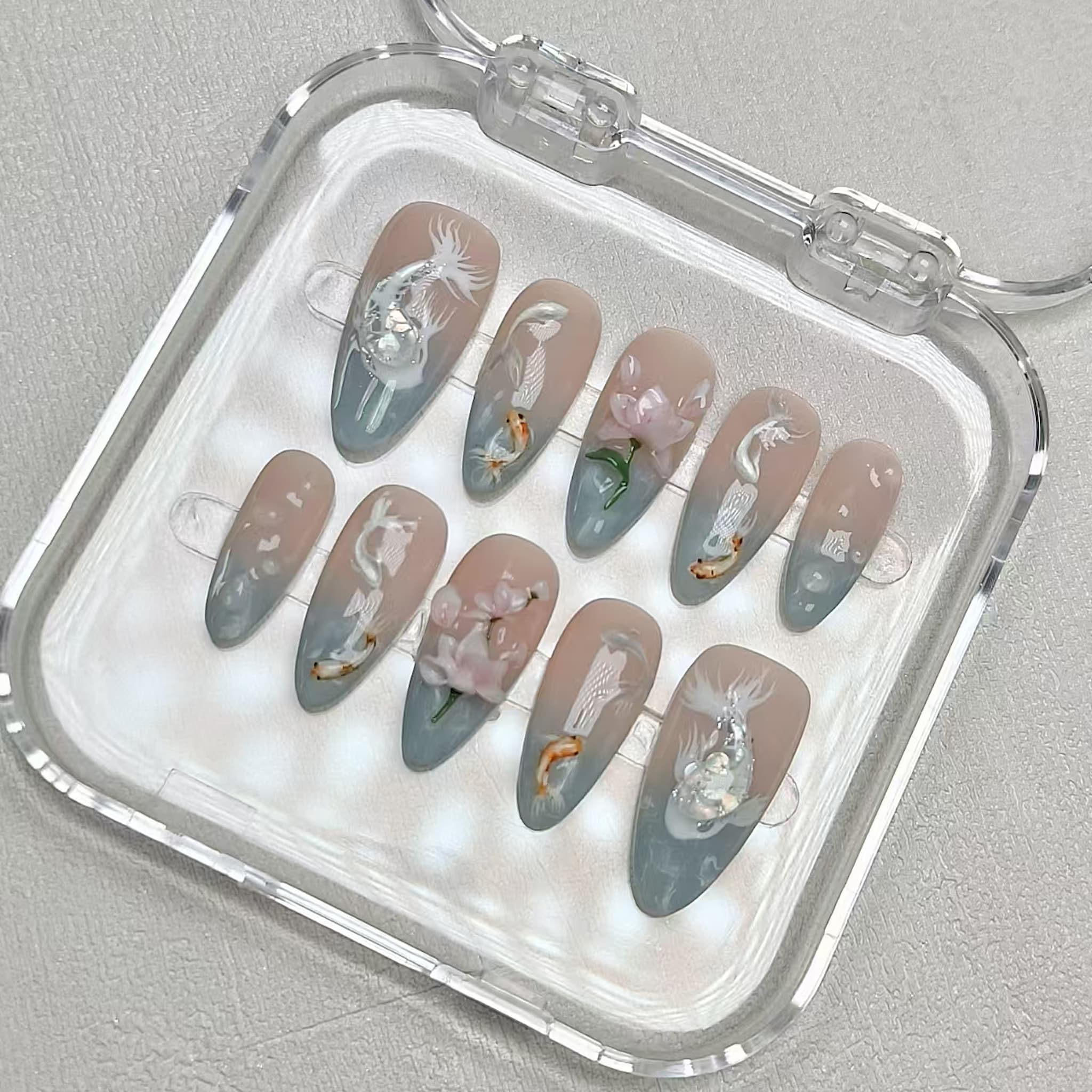medium length light cyan almond press on nails with koi fish design