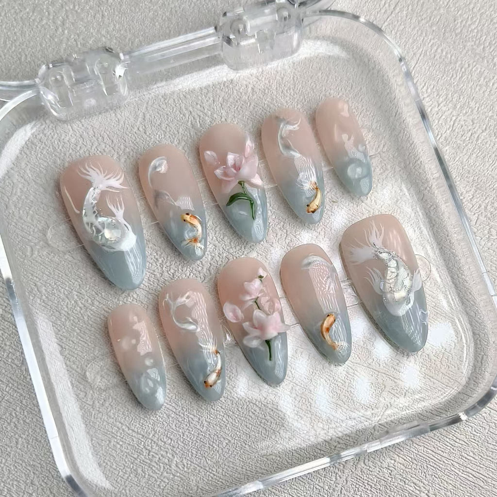 medium length light cyan almond press on nails with koi fish design