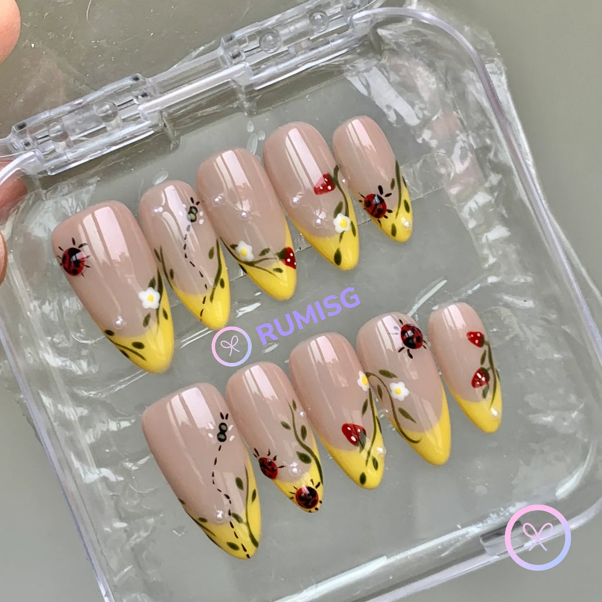  cottagecore nude glossy medium almond press on nails with ladybug and daisy