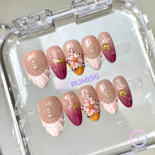 oceanic nude glossy short almond press on nails with seashell charm and 3d flower