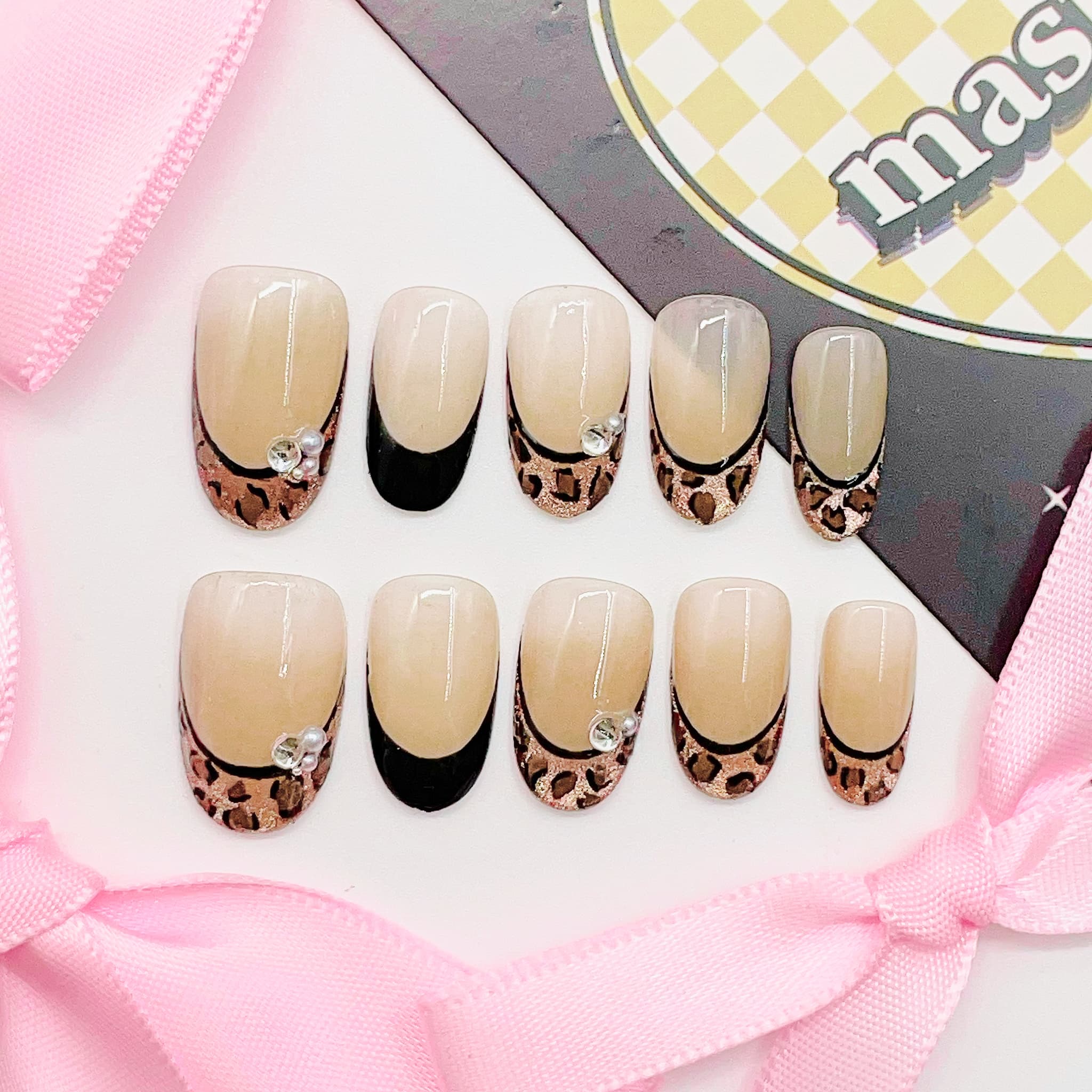 Set of nail art designs with leopard print patterns