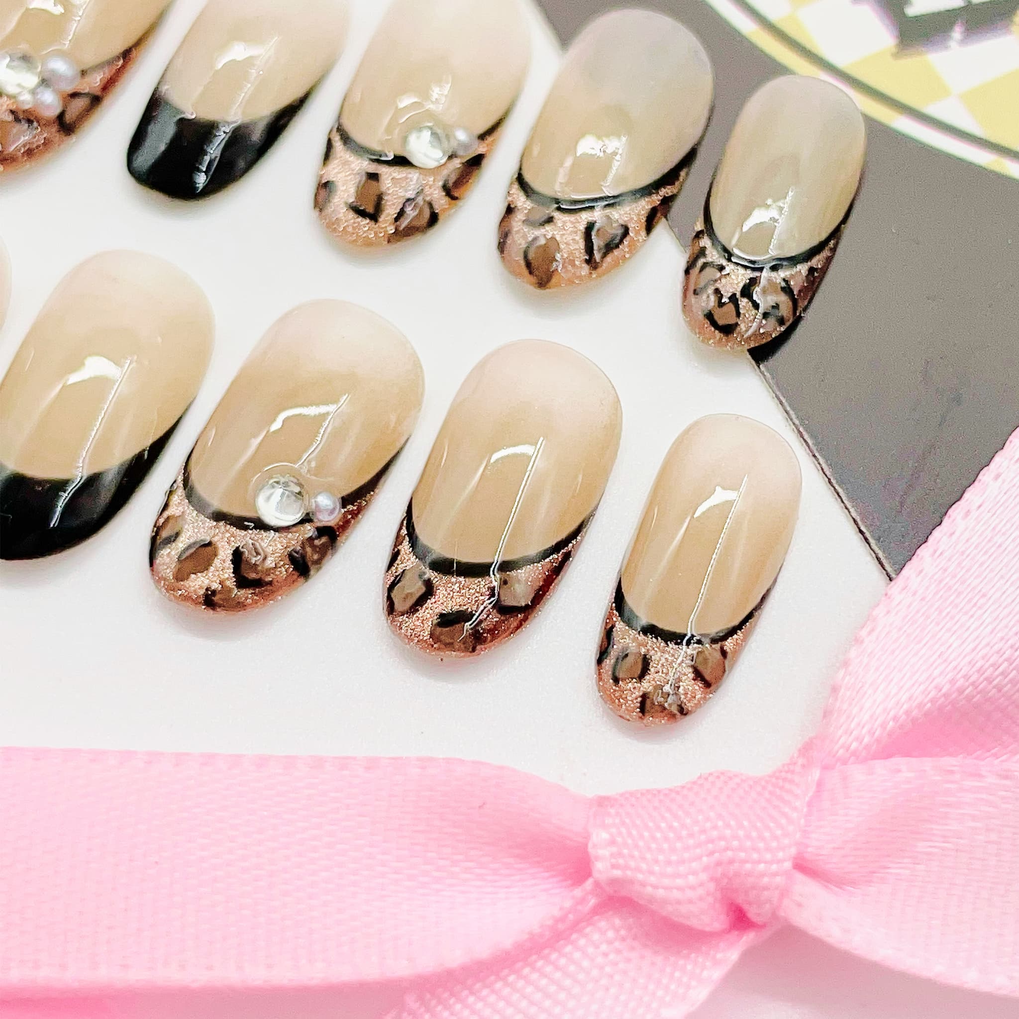 Set of nail art designs with leopard print patterns