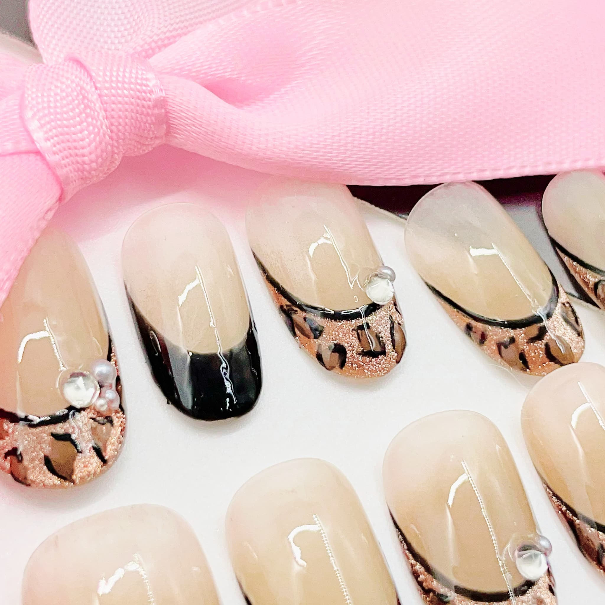 Set of nail art designs with leopard print patterns