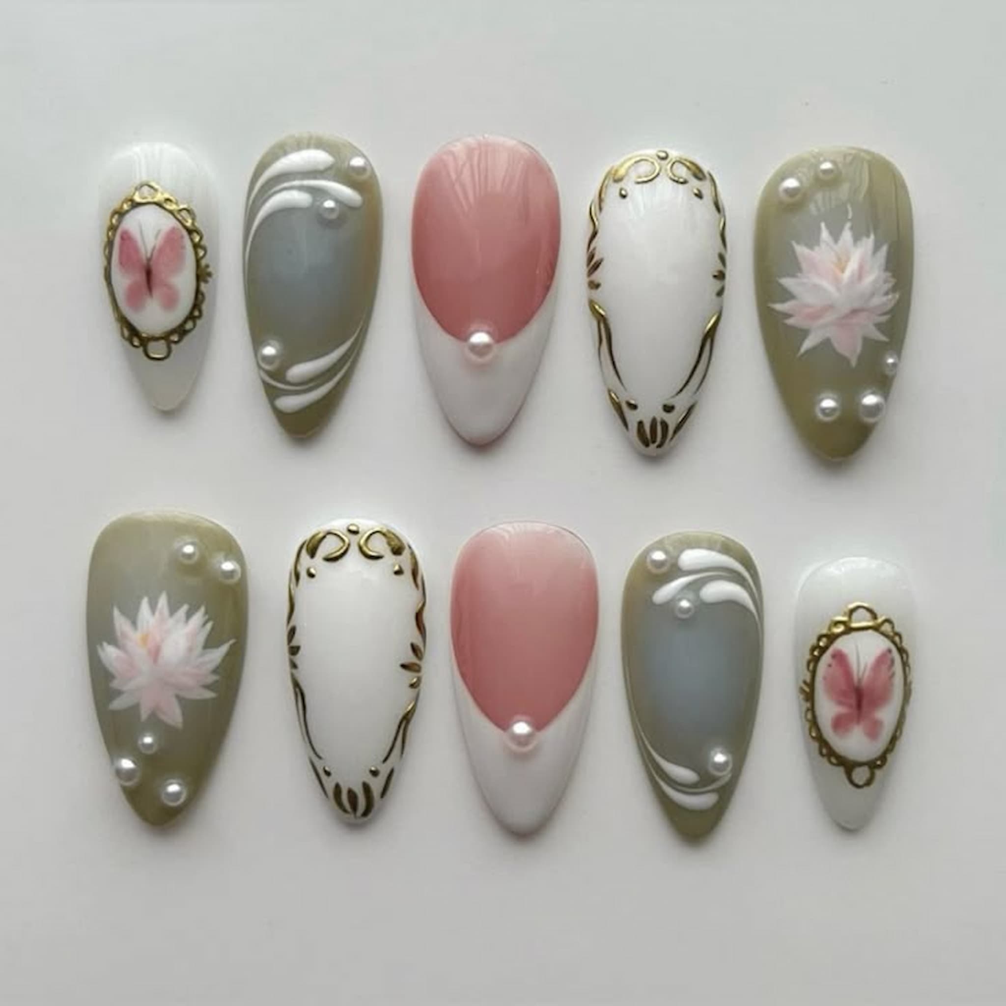 medium length white almond press on nails with lotus design