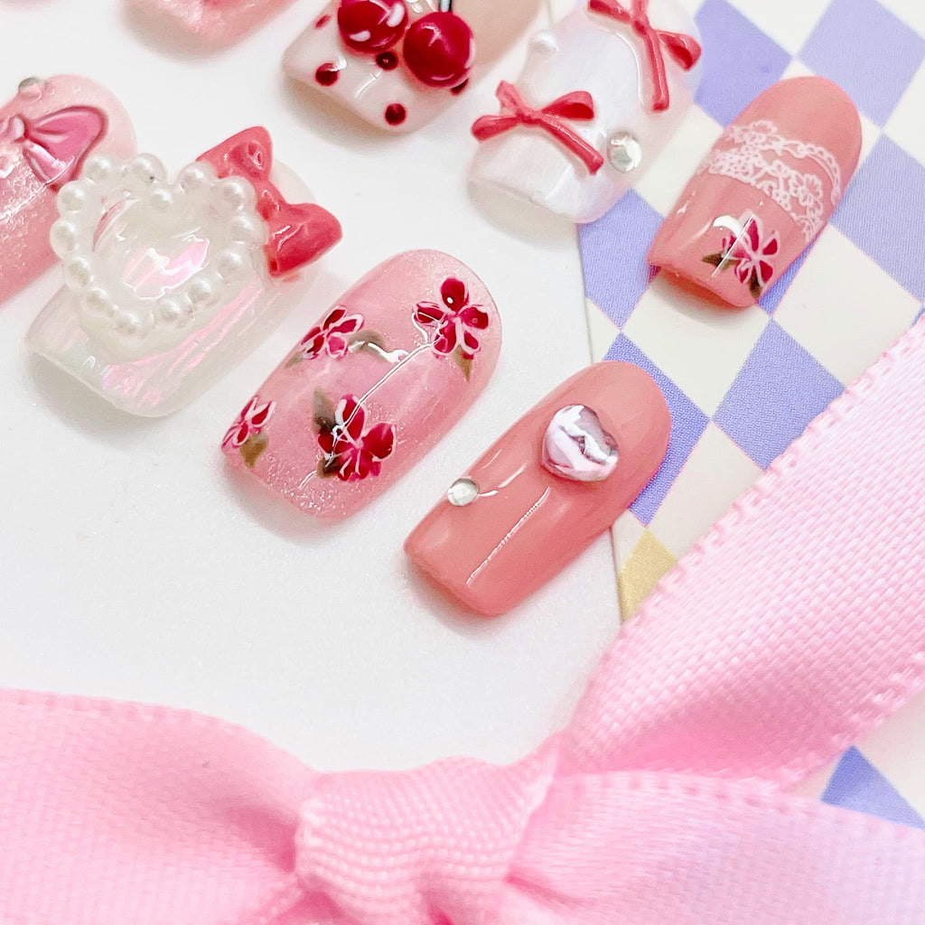 short length pink coffin press on nails with heart shape design