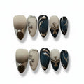 gothic bue glossy medium almond press on nails with cross charm and metallic swirls