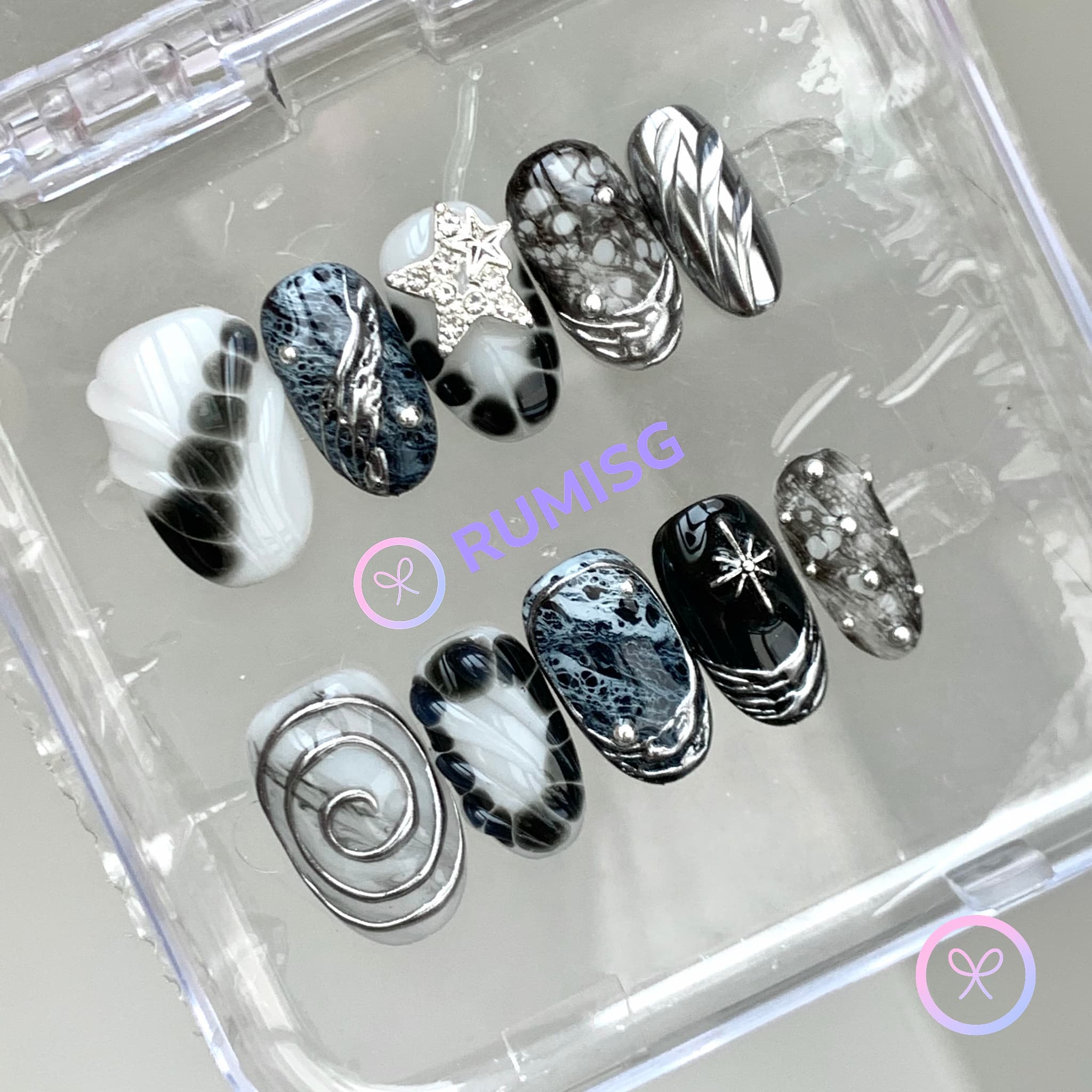 goth black glossy short oval press on nails with bloom scales and chrome swirls