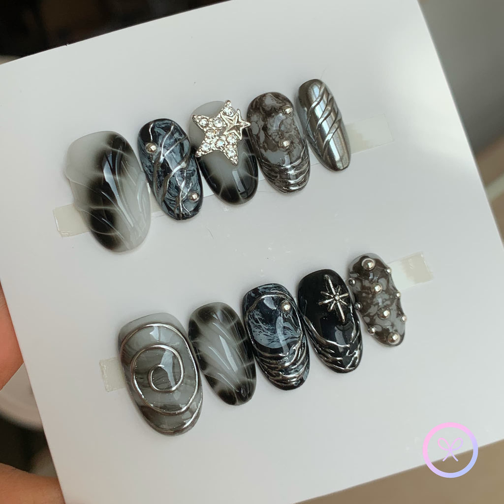 gothic black glossy short oval press on nails with chrome swirls and bloom scale