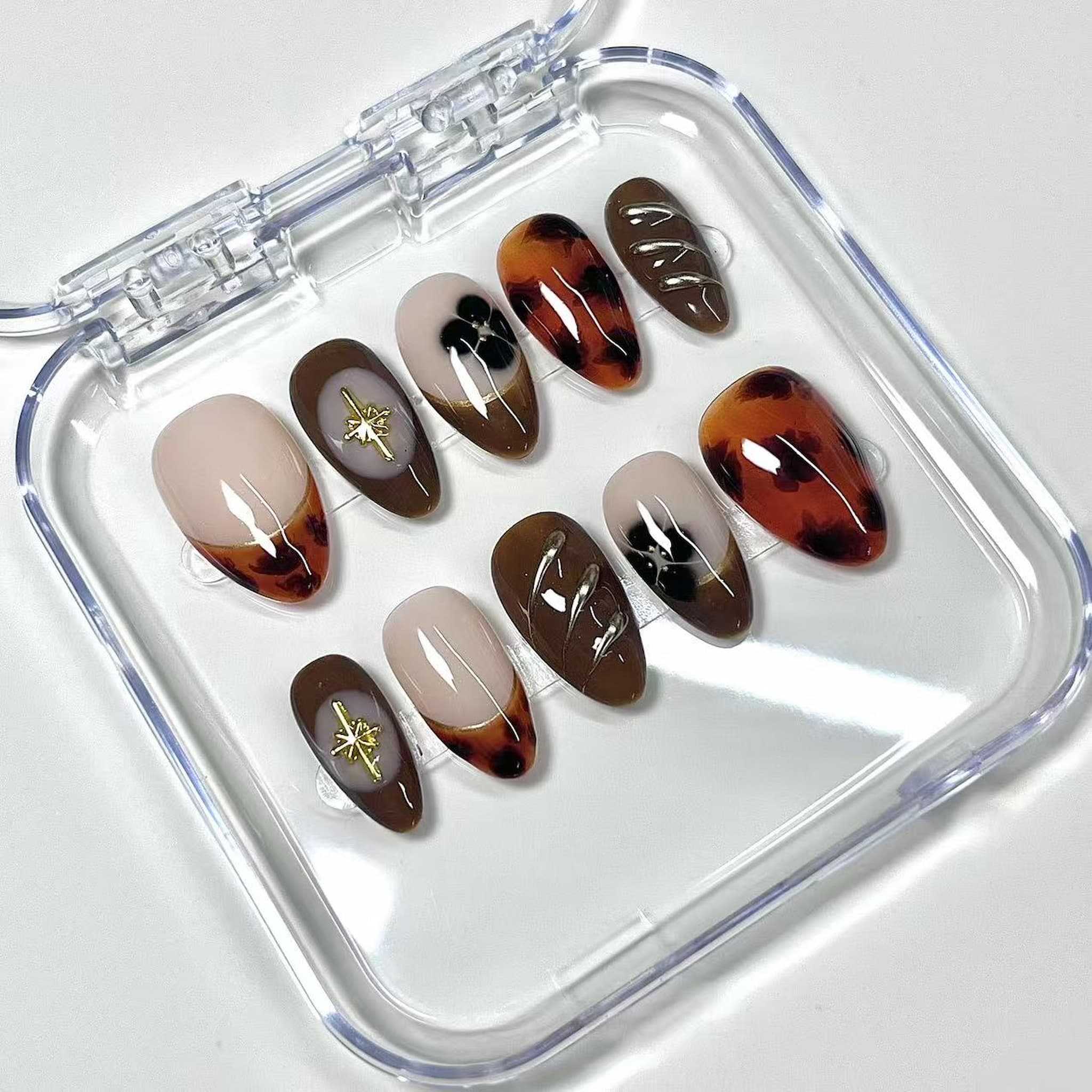 short length saddle brown almond press on nails with marbled looks