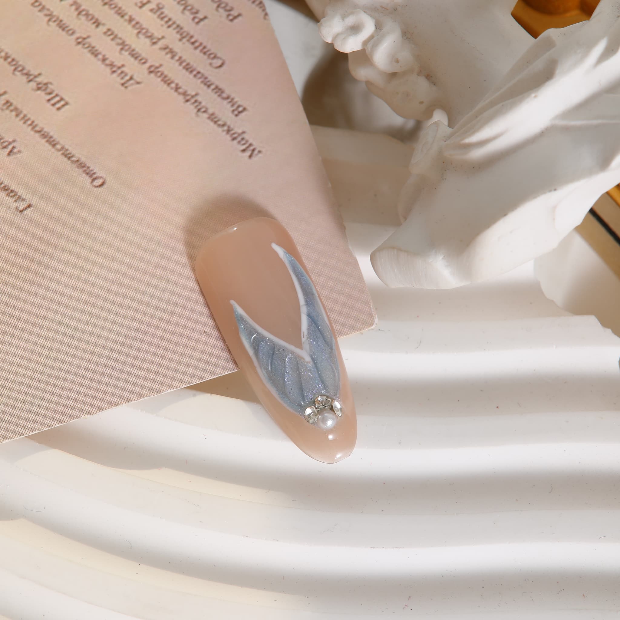 long length light blue oval press on nails with mermaid tails design and gemstones
