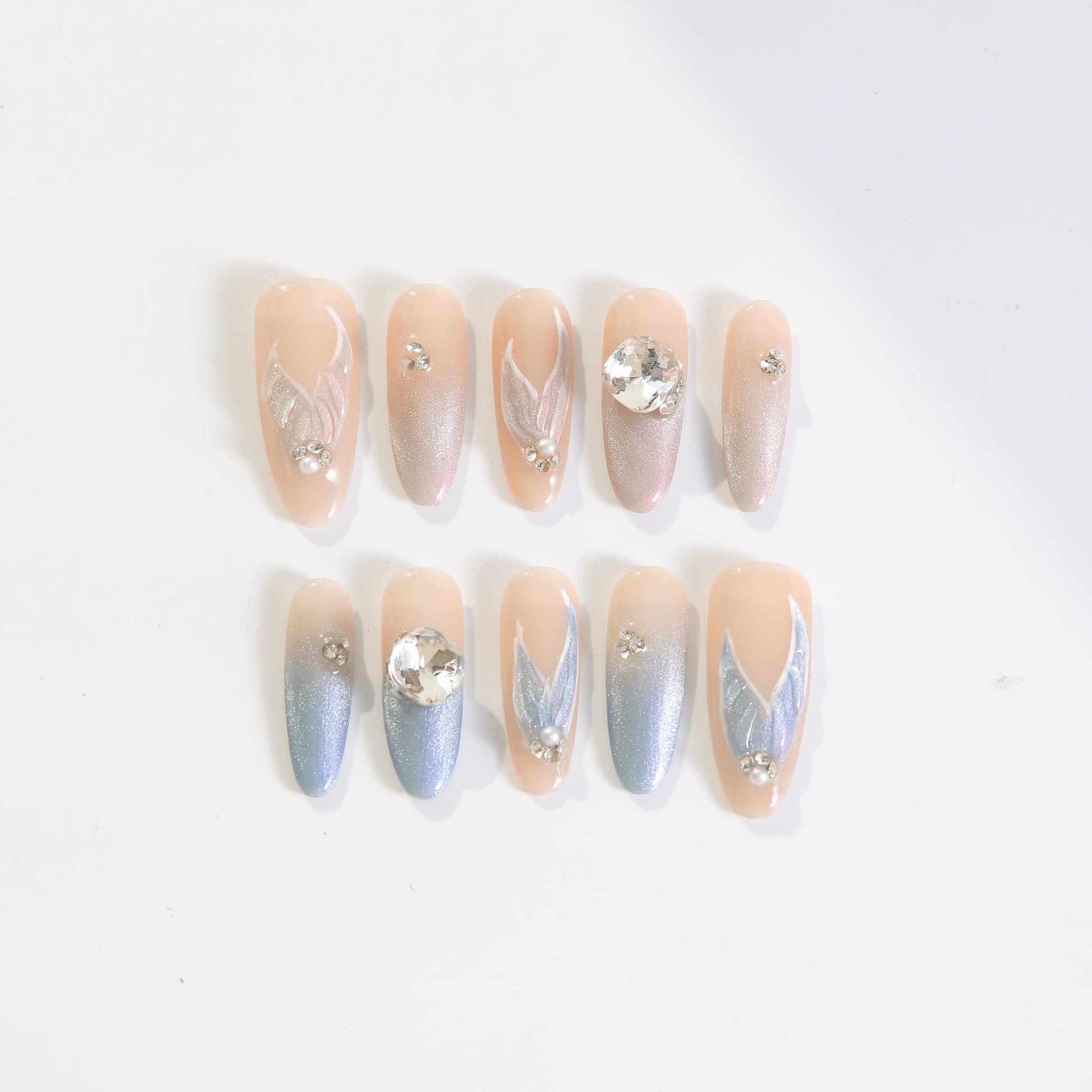 long length light blue oval press on nails with mermaid tails design and gemstones