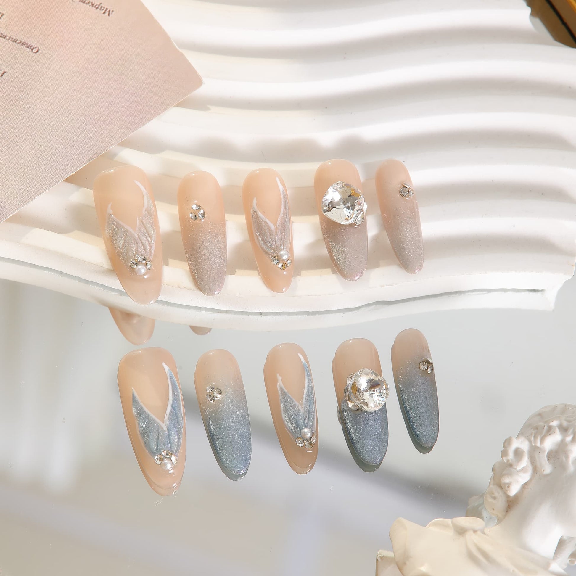 long length light blue oval press on nails with mermaid tails design and gemstones