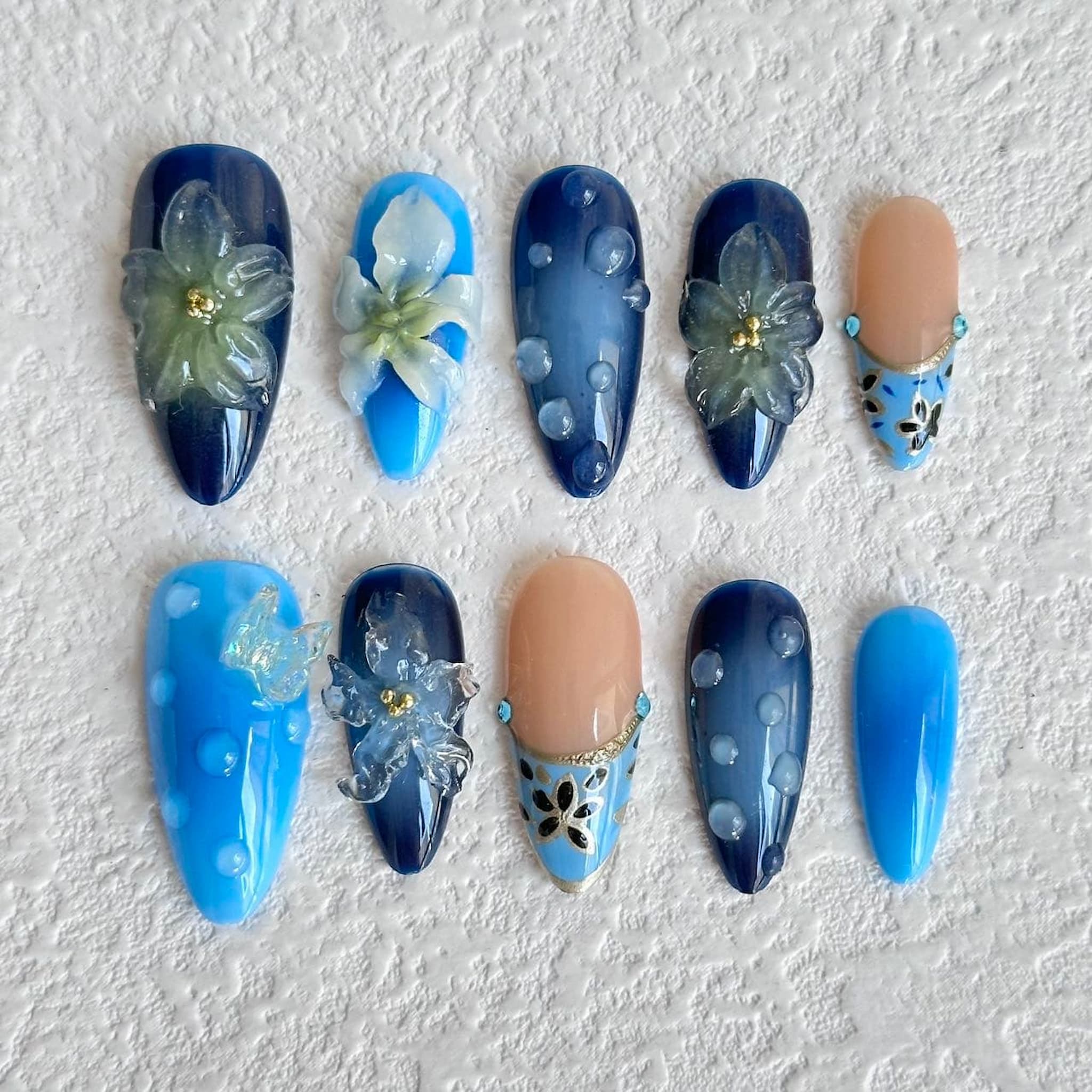 medium length sky blue almond press on nails with floral design,water droplet press on nails, butterfly charm