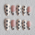 medium length linen almond press on nails with black daisy design