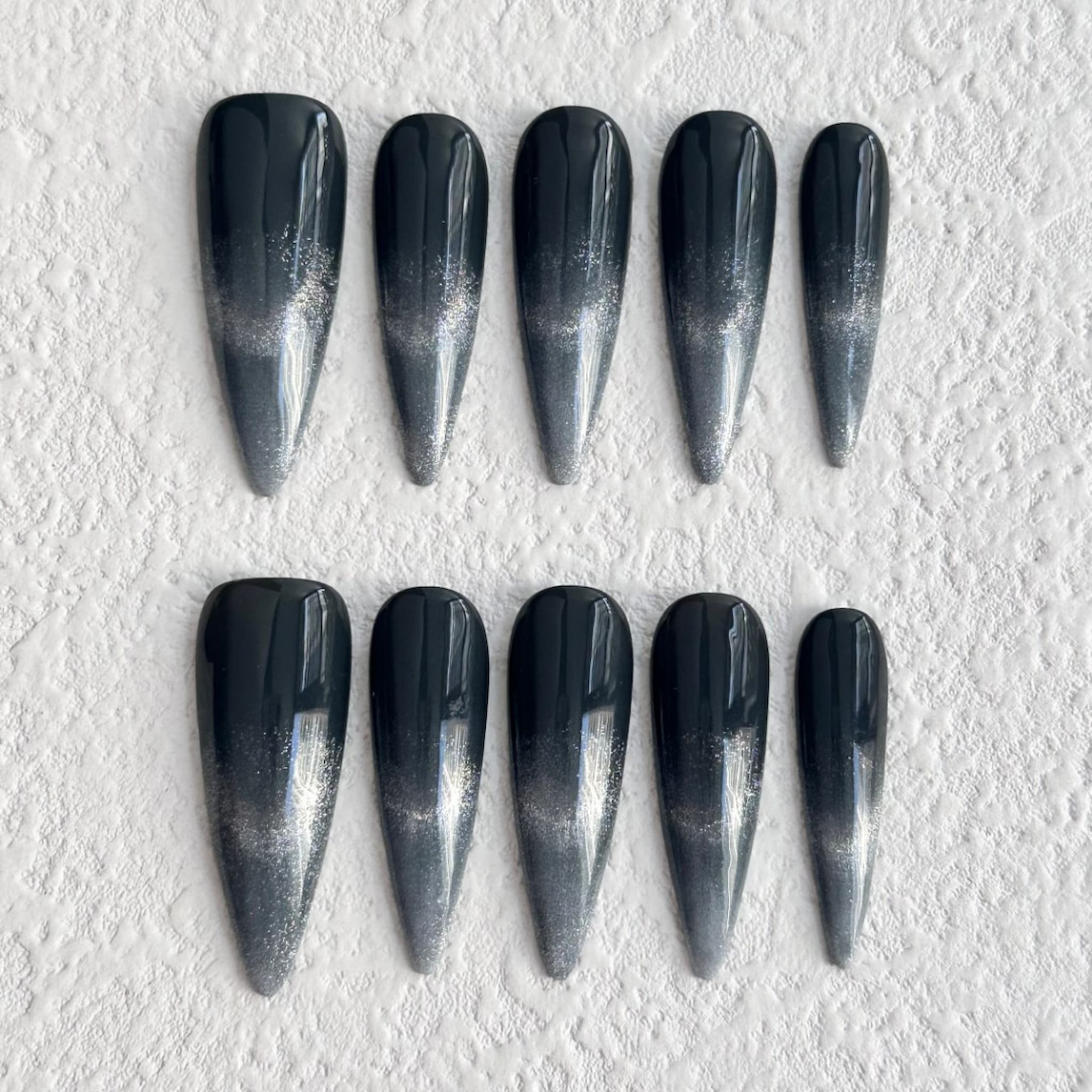 long length black stiletto press on nails with black to silver gradient