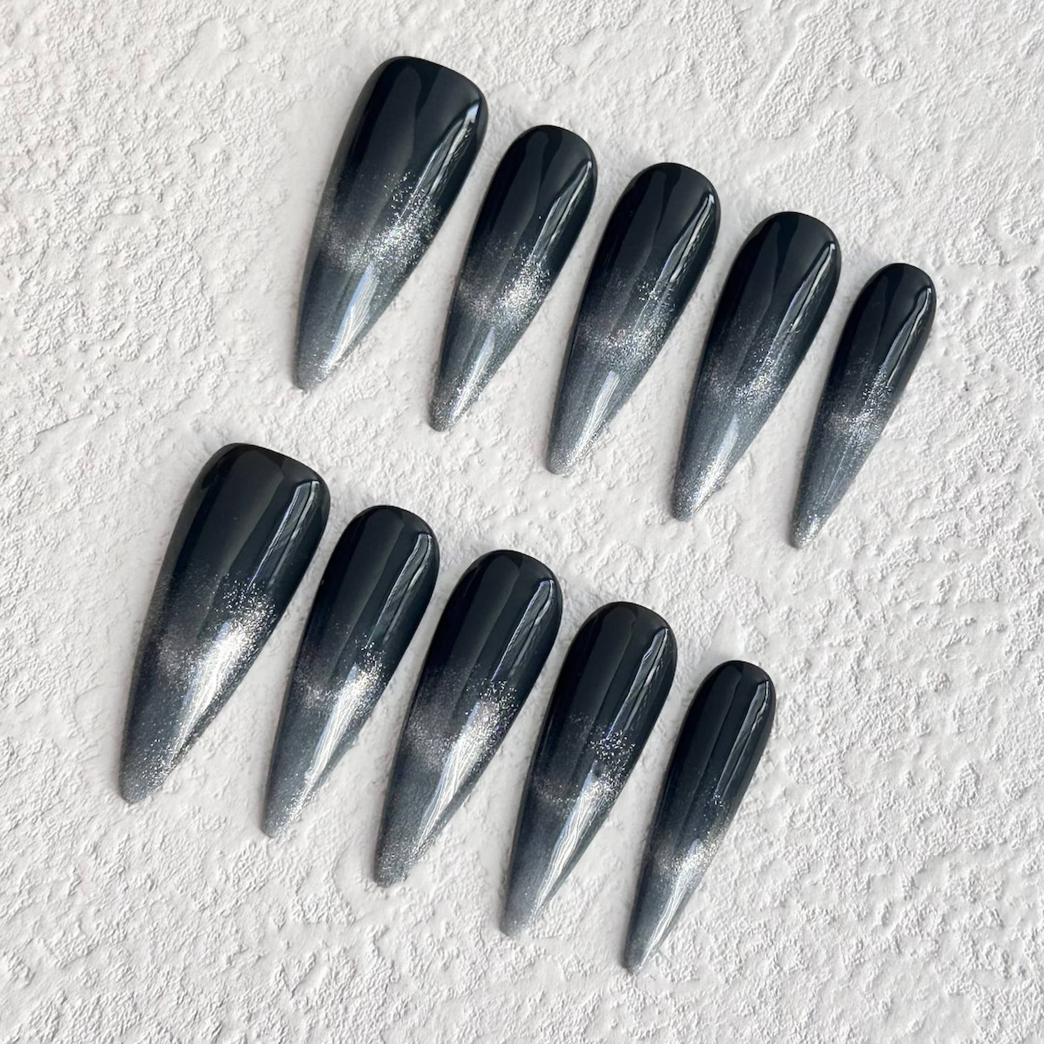 long length black stiletto press on nails with black to silver gradient