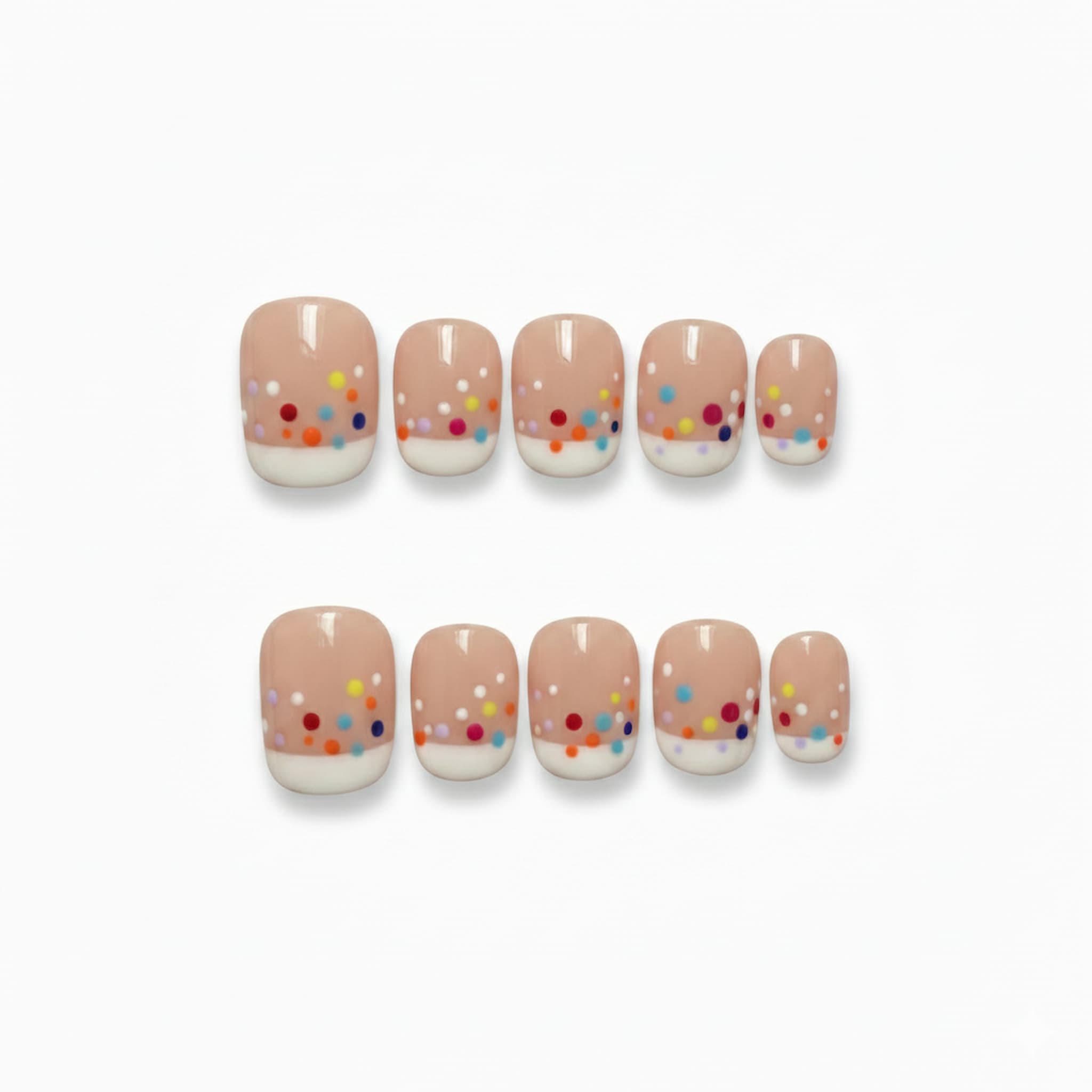 cute nude glossy short round press on nails with confetti like dots , french tip