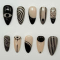 medium length black press on nails with abstract design