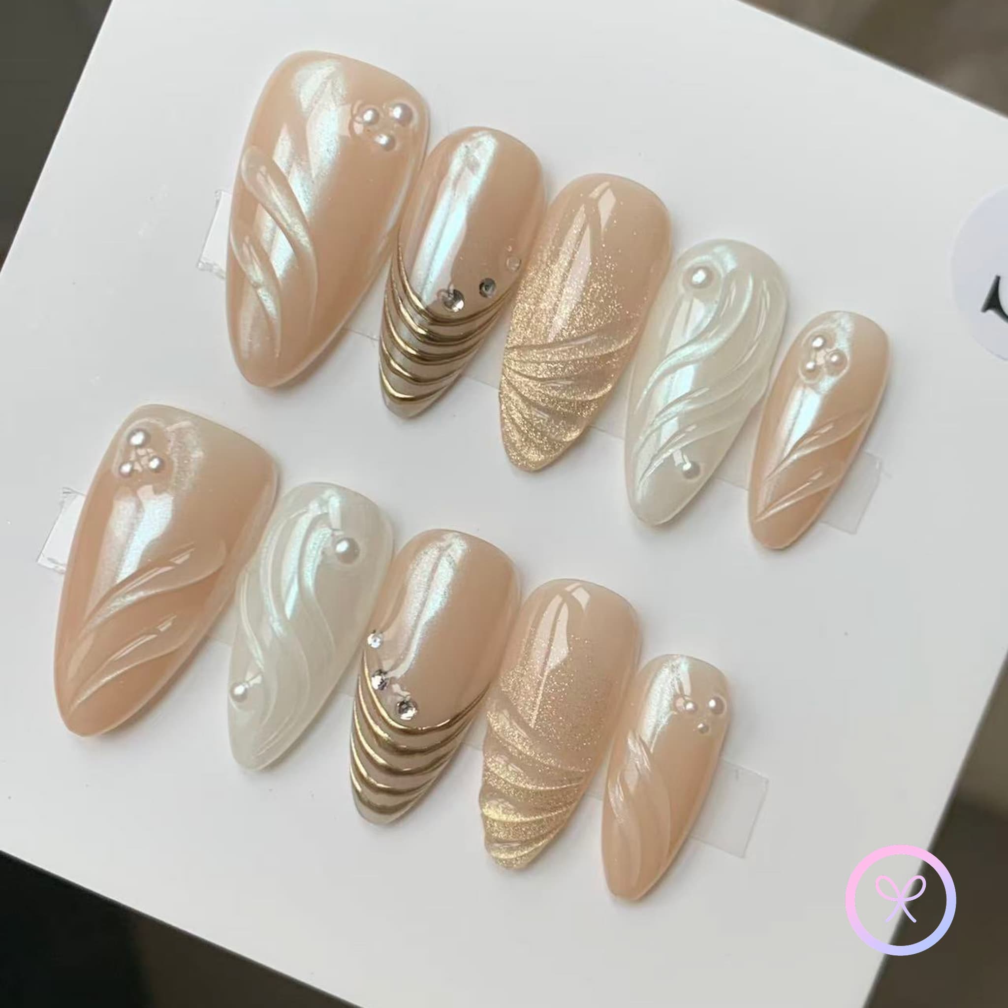 pearlcore white pearlescent medium almond press on nails with swirls and pearls