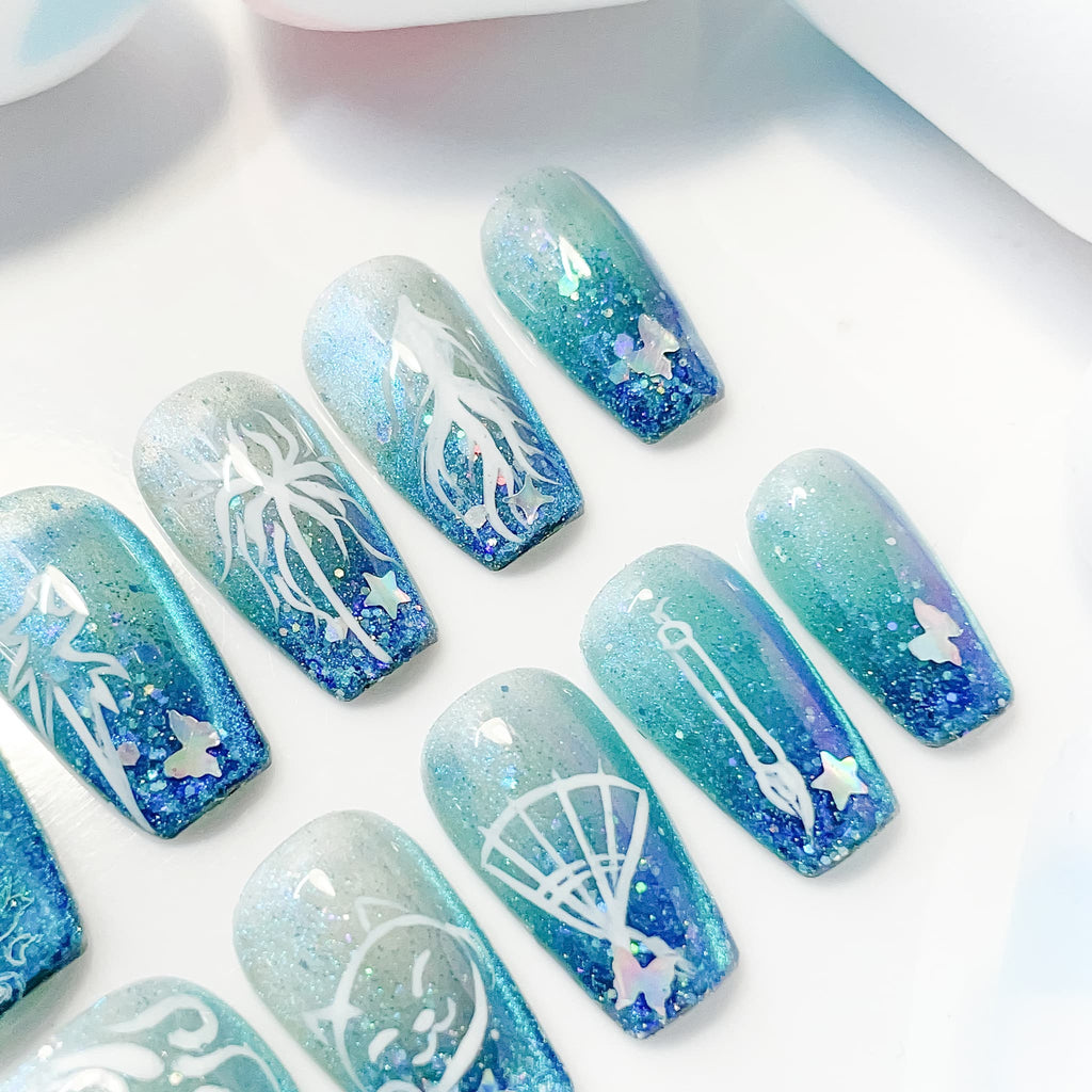 medium length teal coffin press on nails with game inspired designs