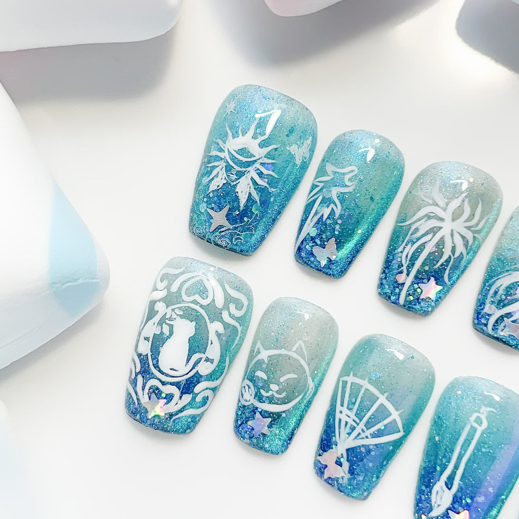 medium length teal coffin press on nails with game inspired designs