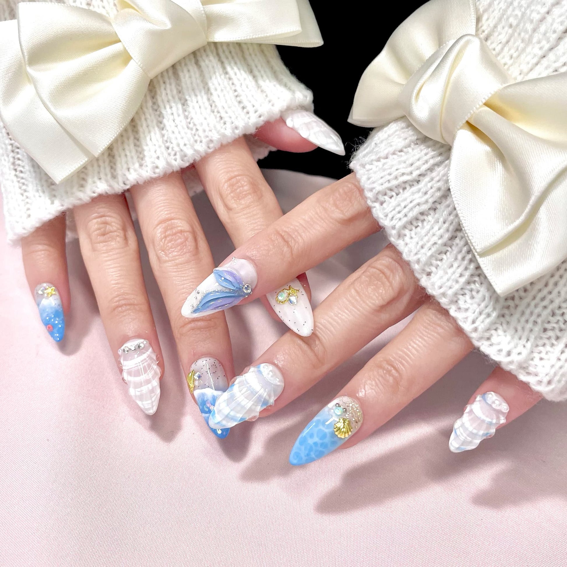 medium length royal blue almond press on nails with seashells design