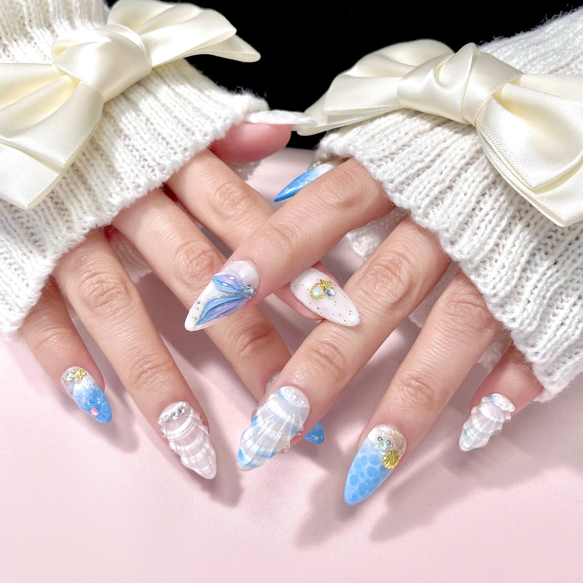 medium length royal blue almond press on nails with seashells design