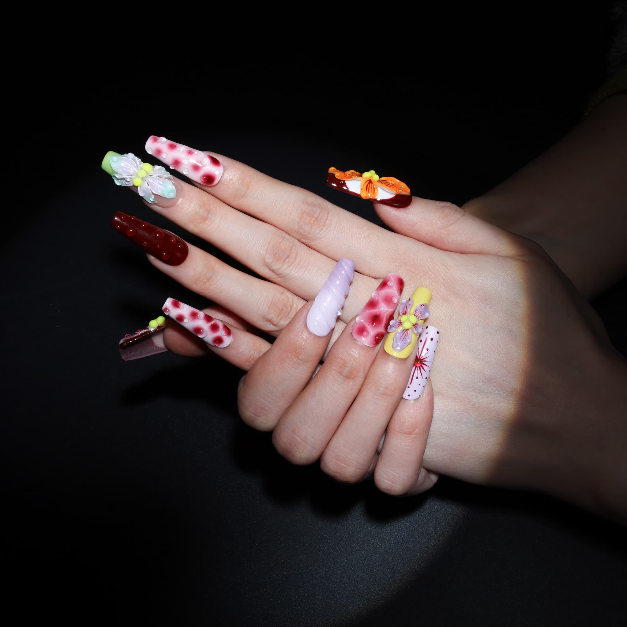 long length rosy brown coffin press on nails with abstract and floral designs. water droplet design