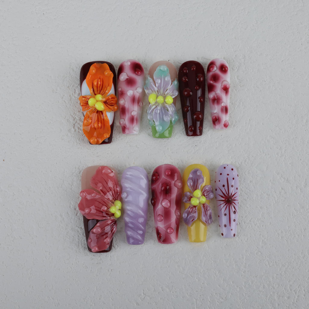 long length rosy brown coffin press on nails with abstract and floral designs. water droplet design