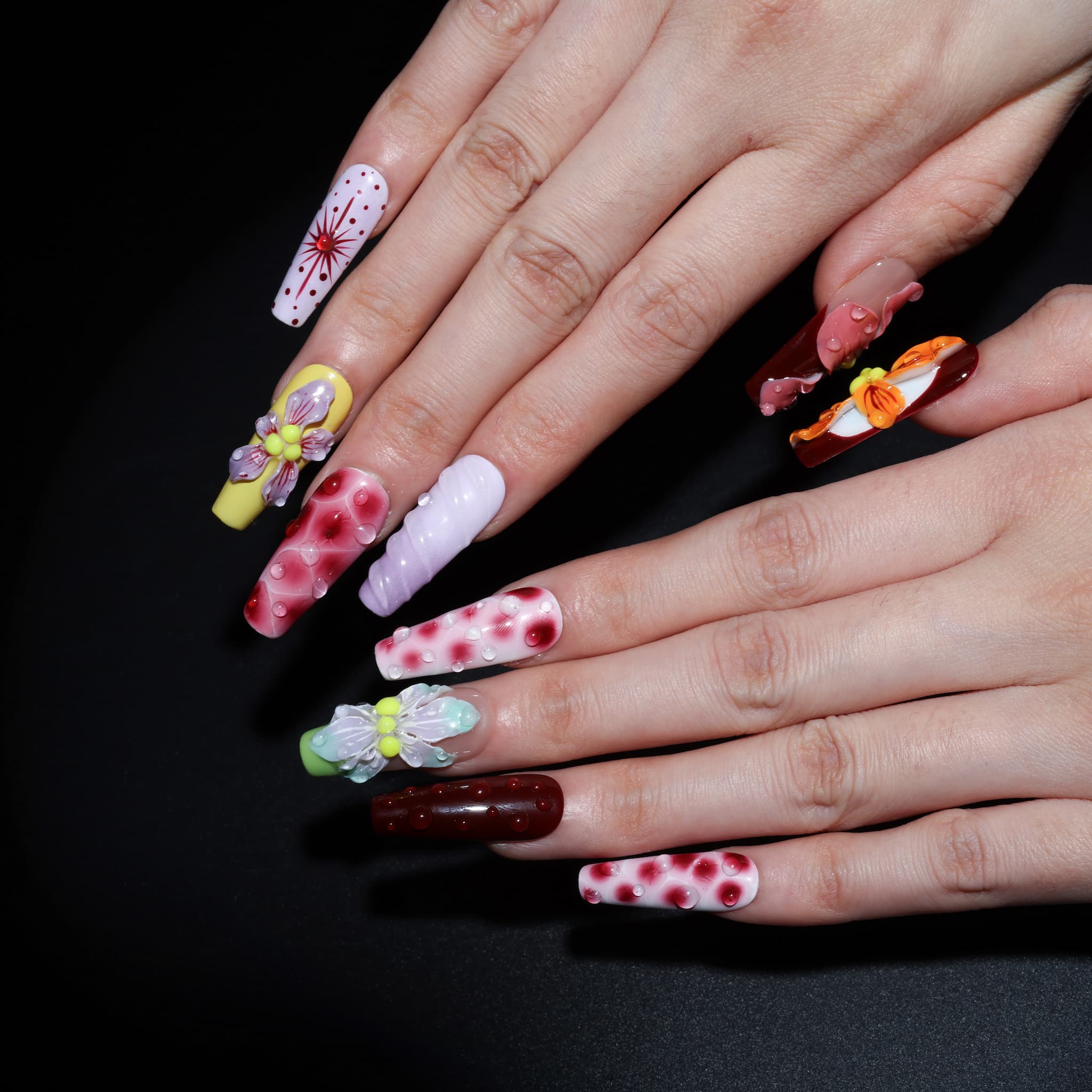 long length rosy brown coffin press on nails with abstract and floral designs. water droplet design
