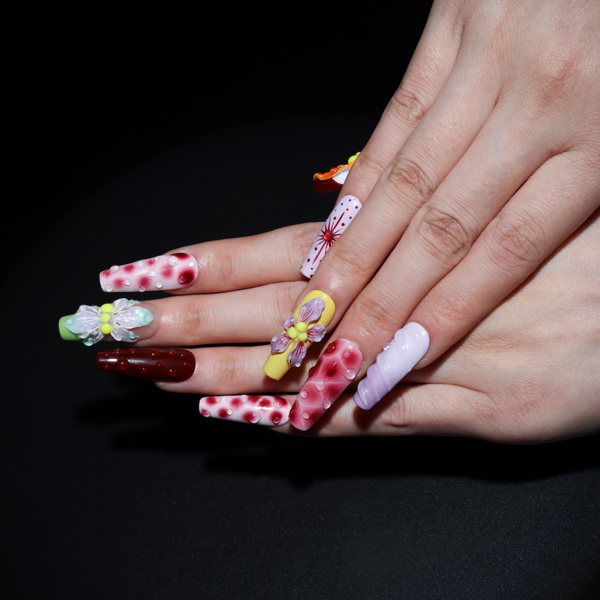 long length rosy brown coffin press on nails with abstract and floral designs. water droplet design