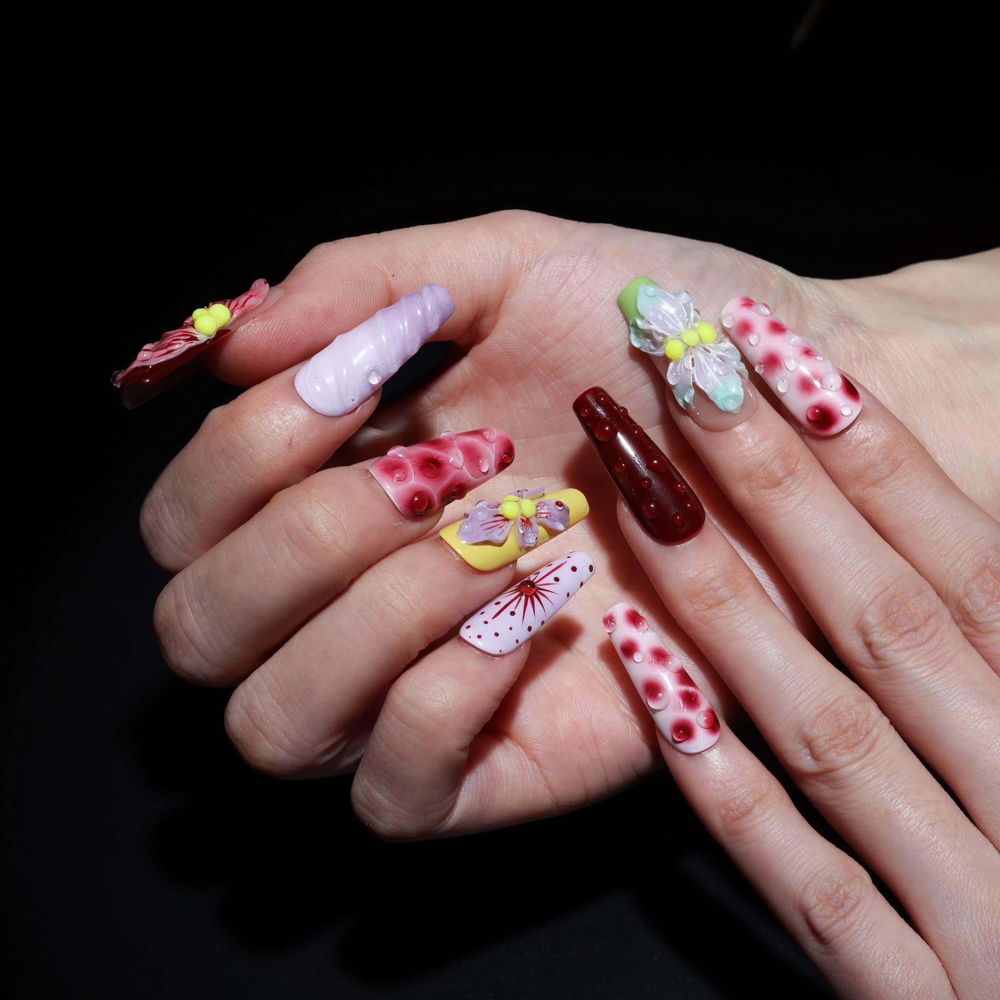 long length rosy brown coffin press on nails with abstract and floral designs. water droplet design
