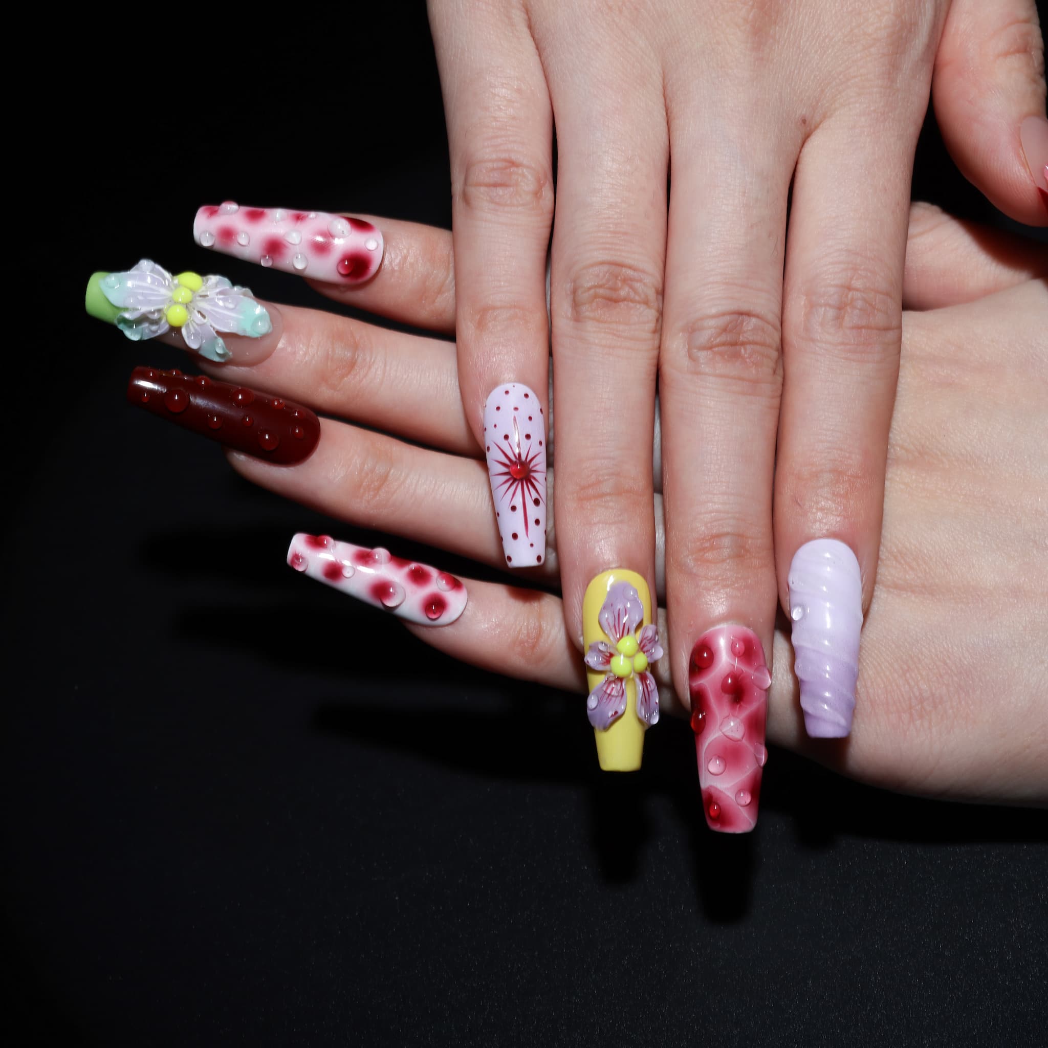 long length rosy brown coffin press on nails with abstract and floral designs. water droplet design