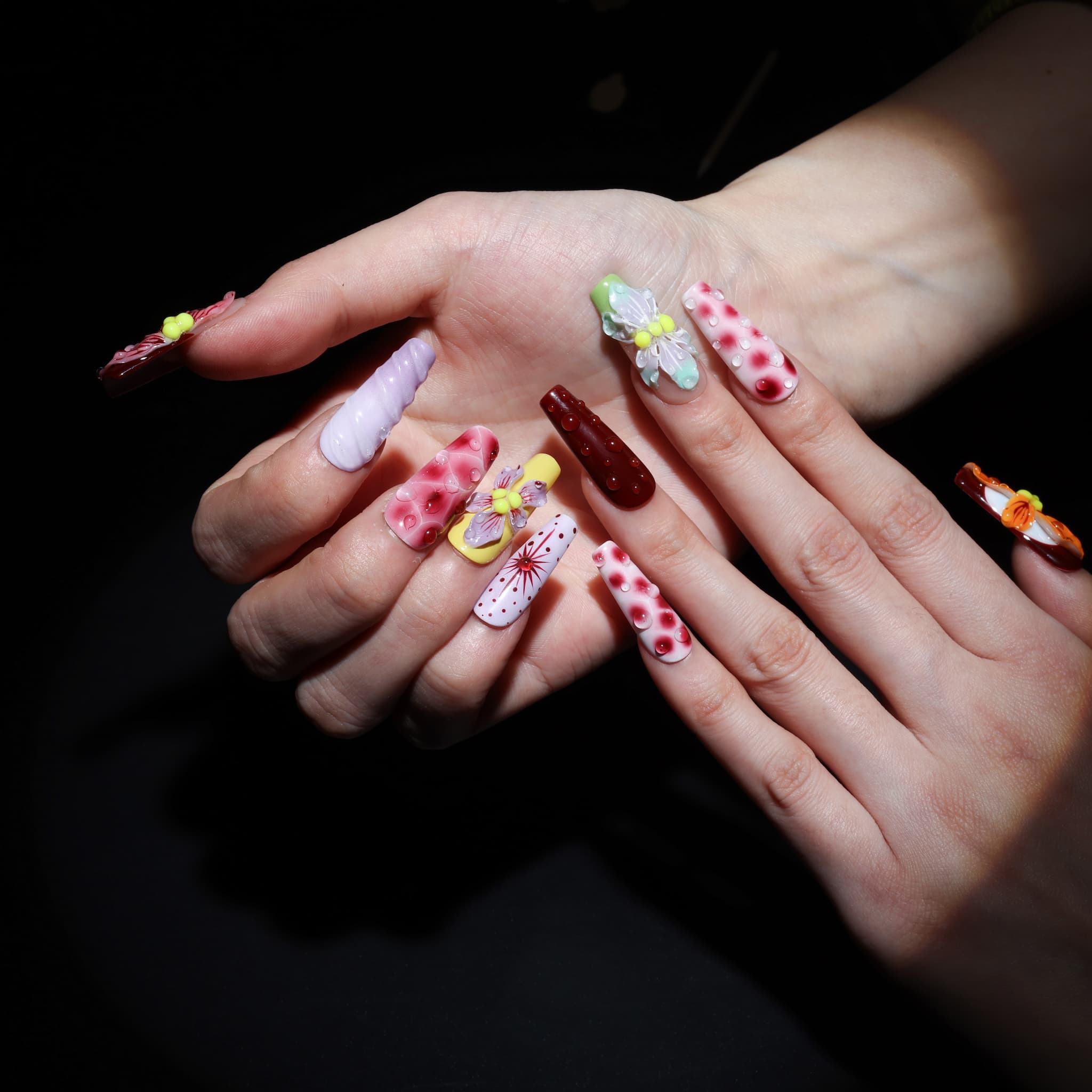 long length rosy brown coffin press on nails with abstract and floral designs. water droplet design