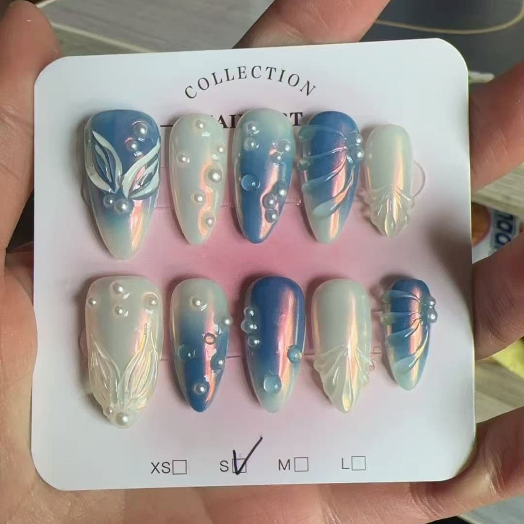 medium length blue almond press on nails with pearls