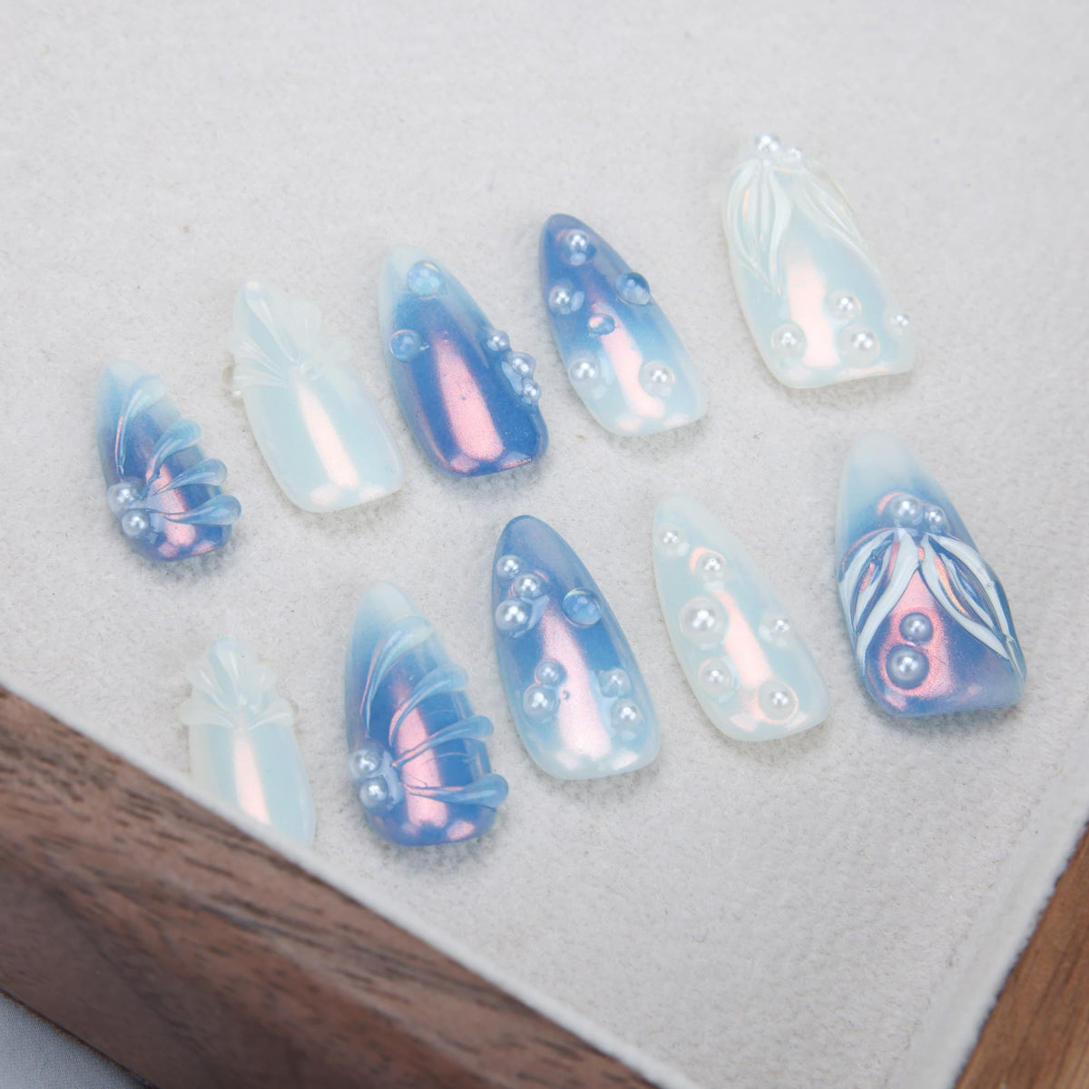 medium length blue almond press on nails with pearls