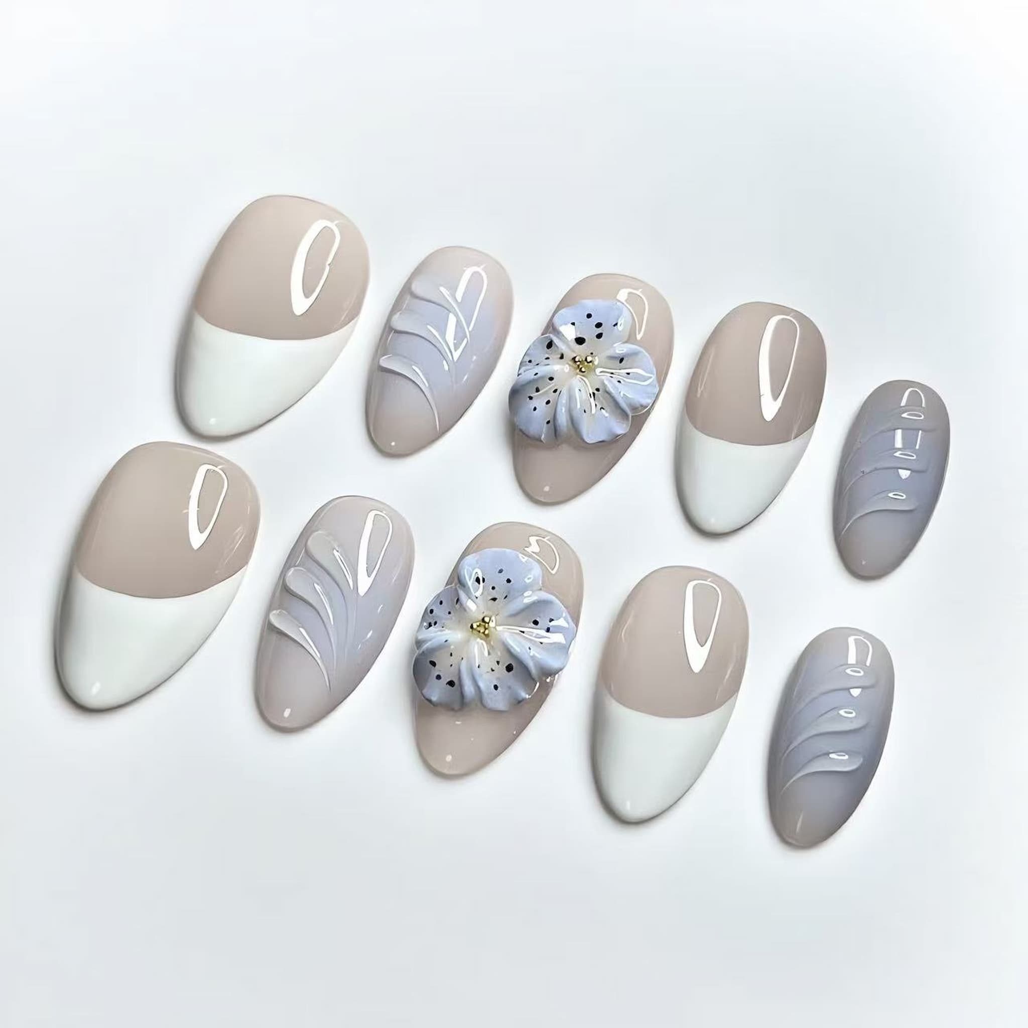short length nude almond press on nails with french tips and 3d flower design