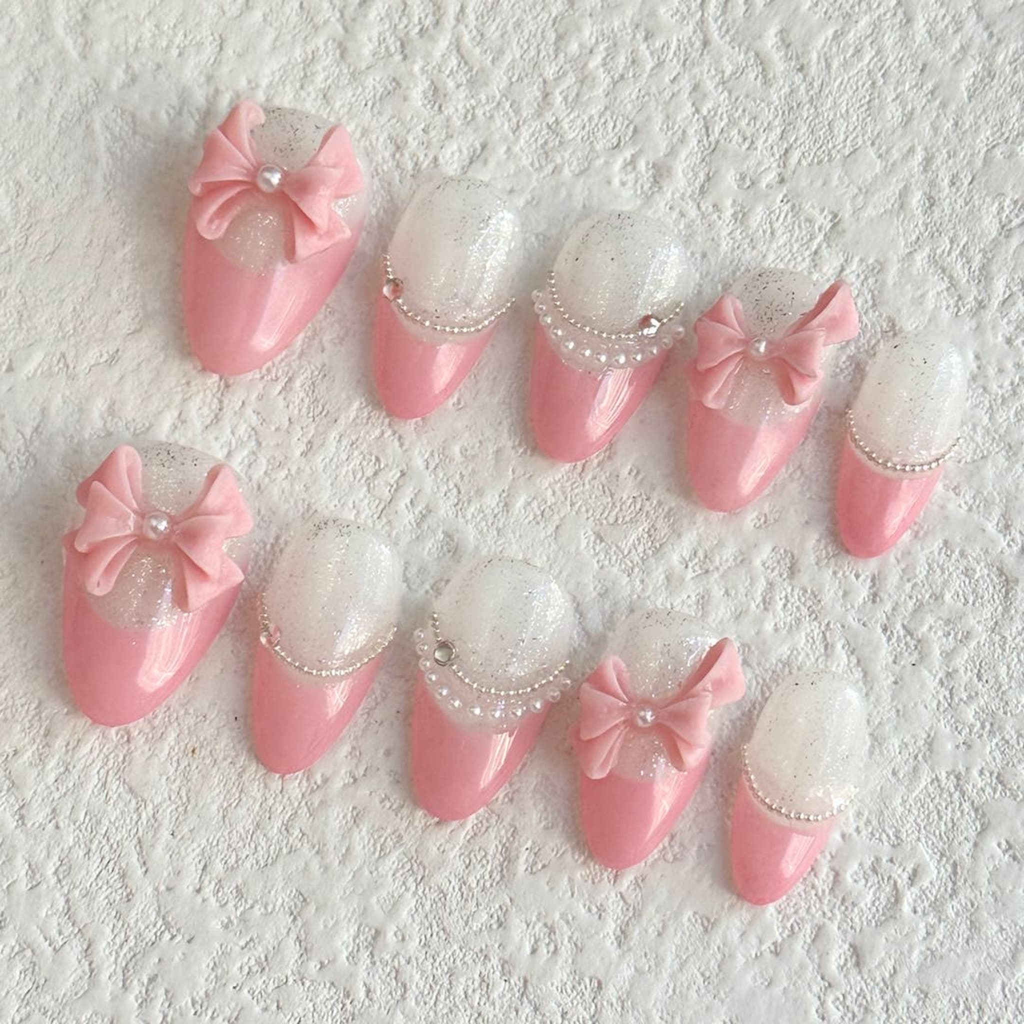short light pink almond press on nails with bow design