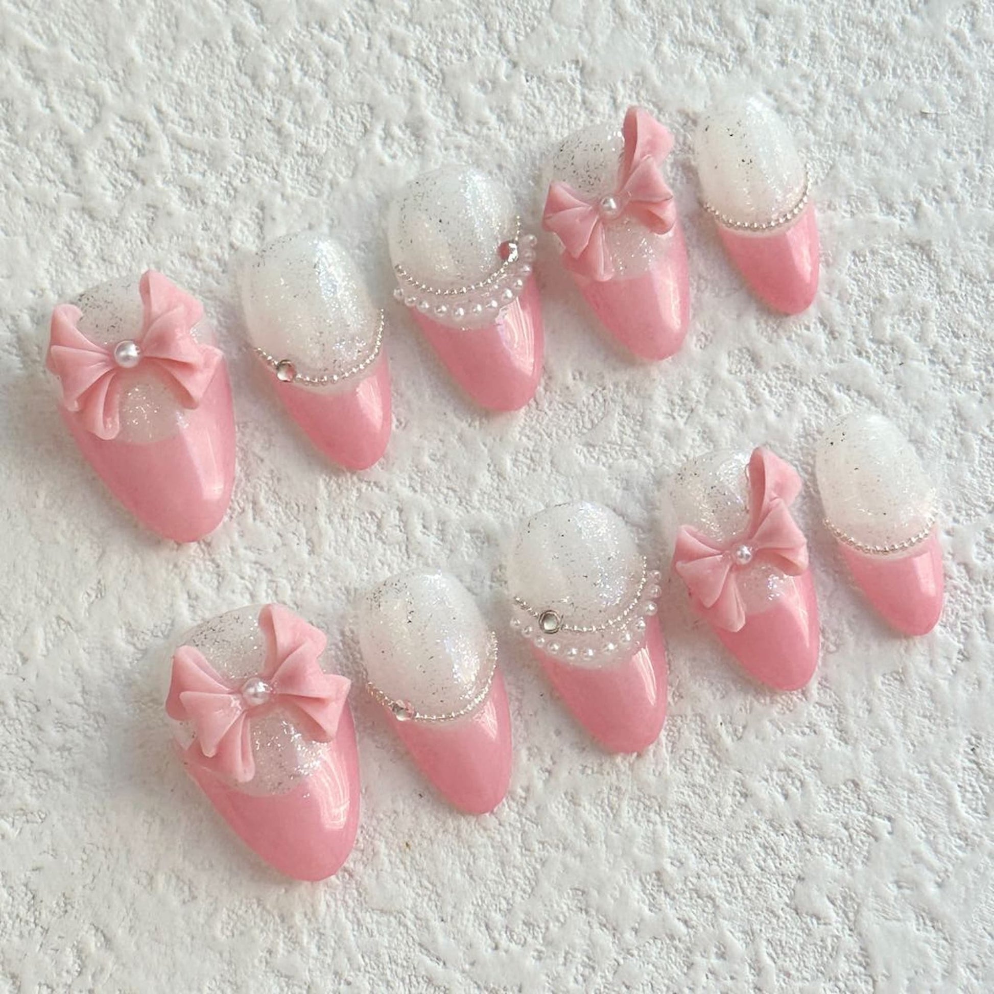 short light pink almond press on nails with bow design