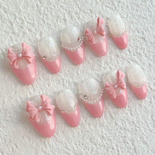 short light pink almond press on nails with bow design