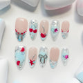 medium length light blue almond press on nails with star and cherries design